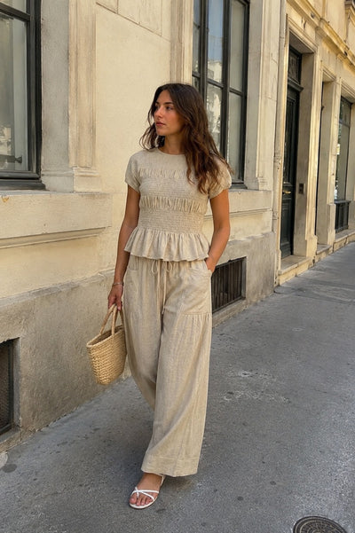 Bellary loungewear set in Beige, worn on a street