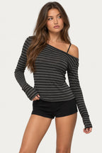 Striped long-sleeve top, worn off one shoulder, from the front