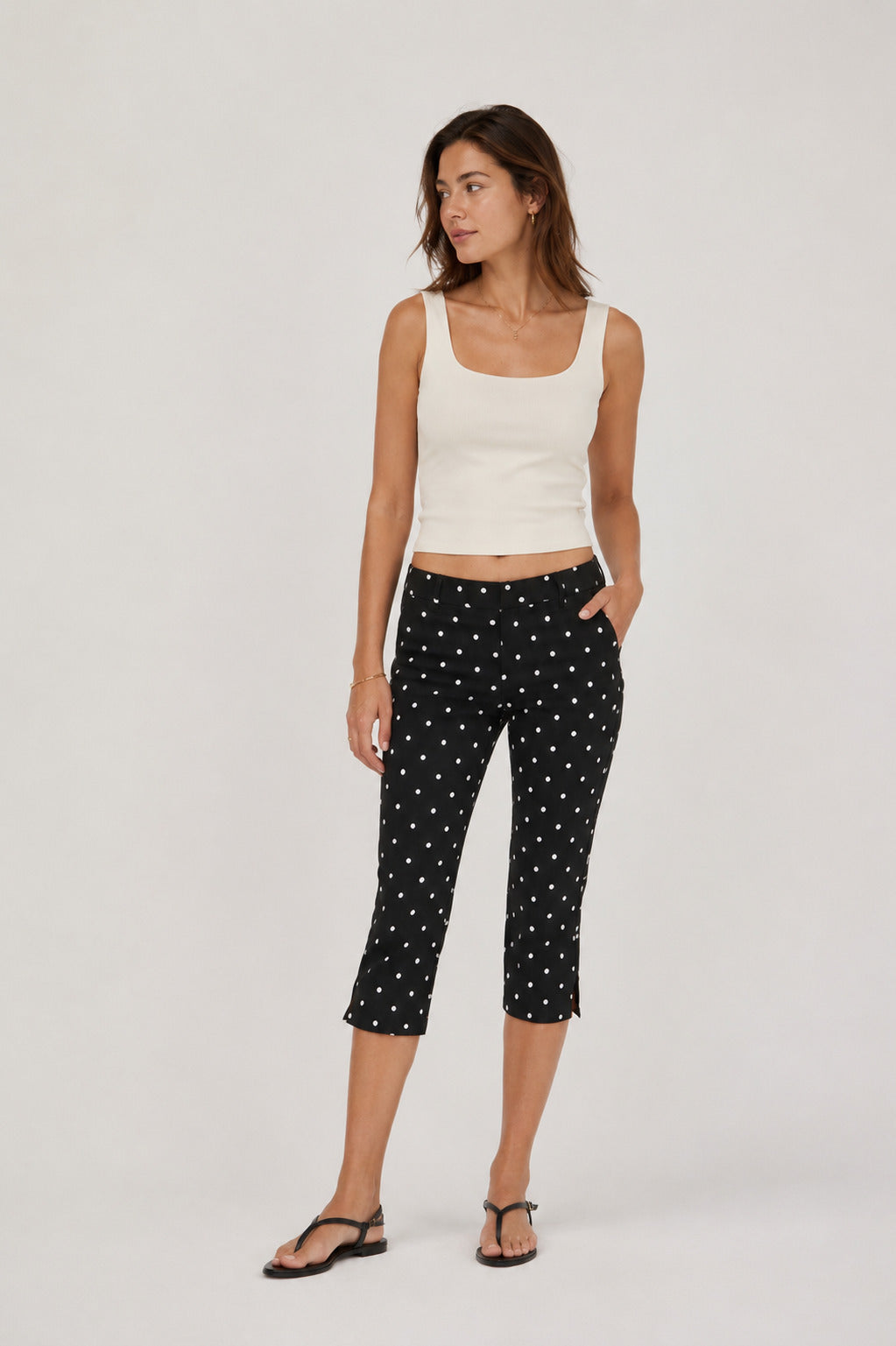 Runa Dots Capri Pants in Black with white dots, full-length front view