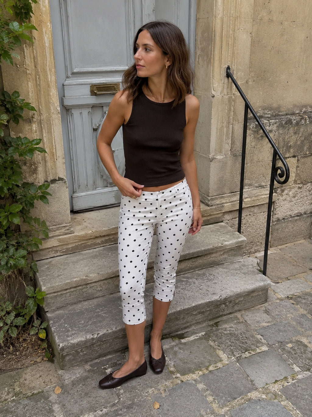 Runa Dots Capri Pants in White with black dots, outdoor shot