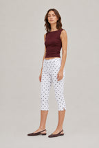 Runa Dots Capri Pants in White with black dots, full-length front view